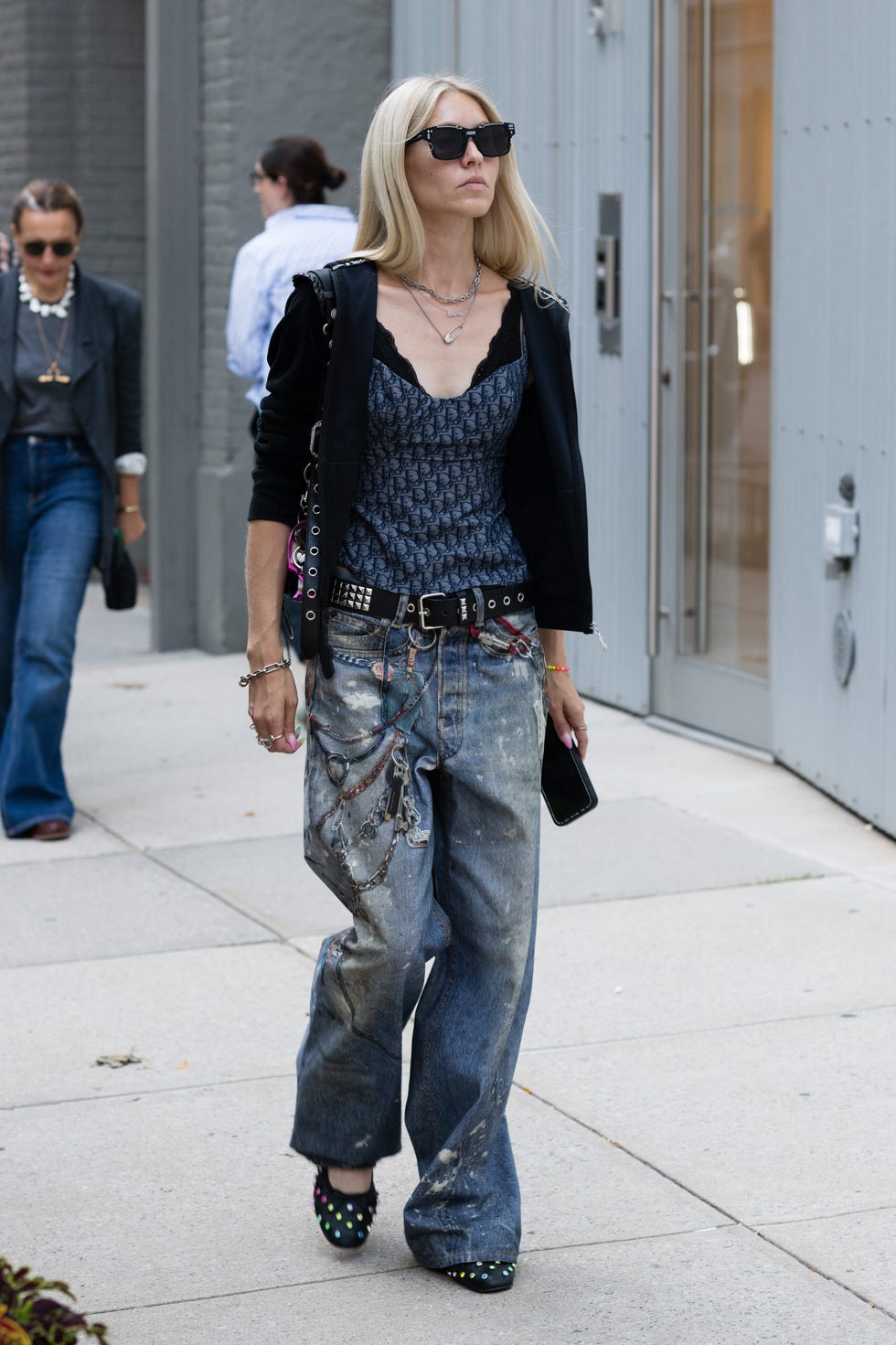 Distressed Baggy Jeans With Chains And Cropped Cardigan — Trendy Baggy Jeans Outfits