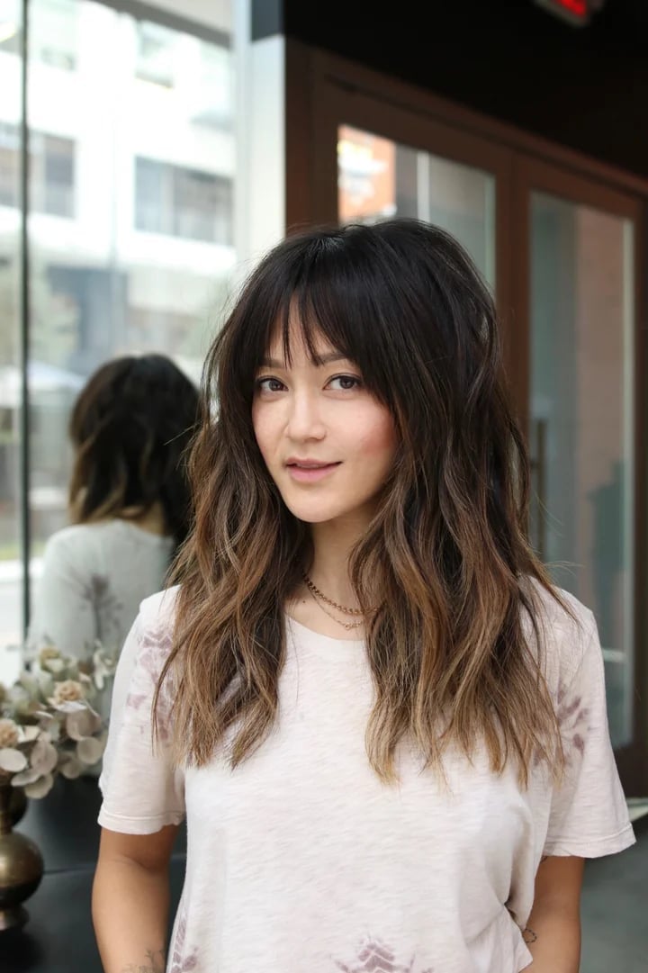 Mid-Back Shag With Full Textured Blunt Bangs and Wavy Texture Mid-Back Shag With Full Textured Blunt Bangs and Wavy Texture — Trendy Bangs Style