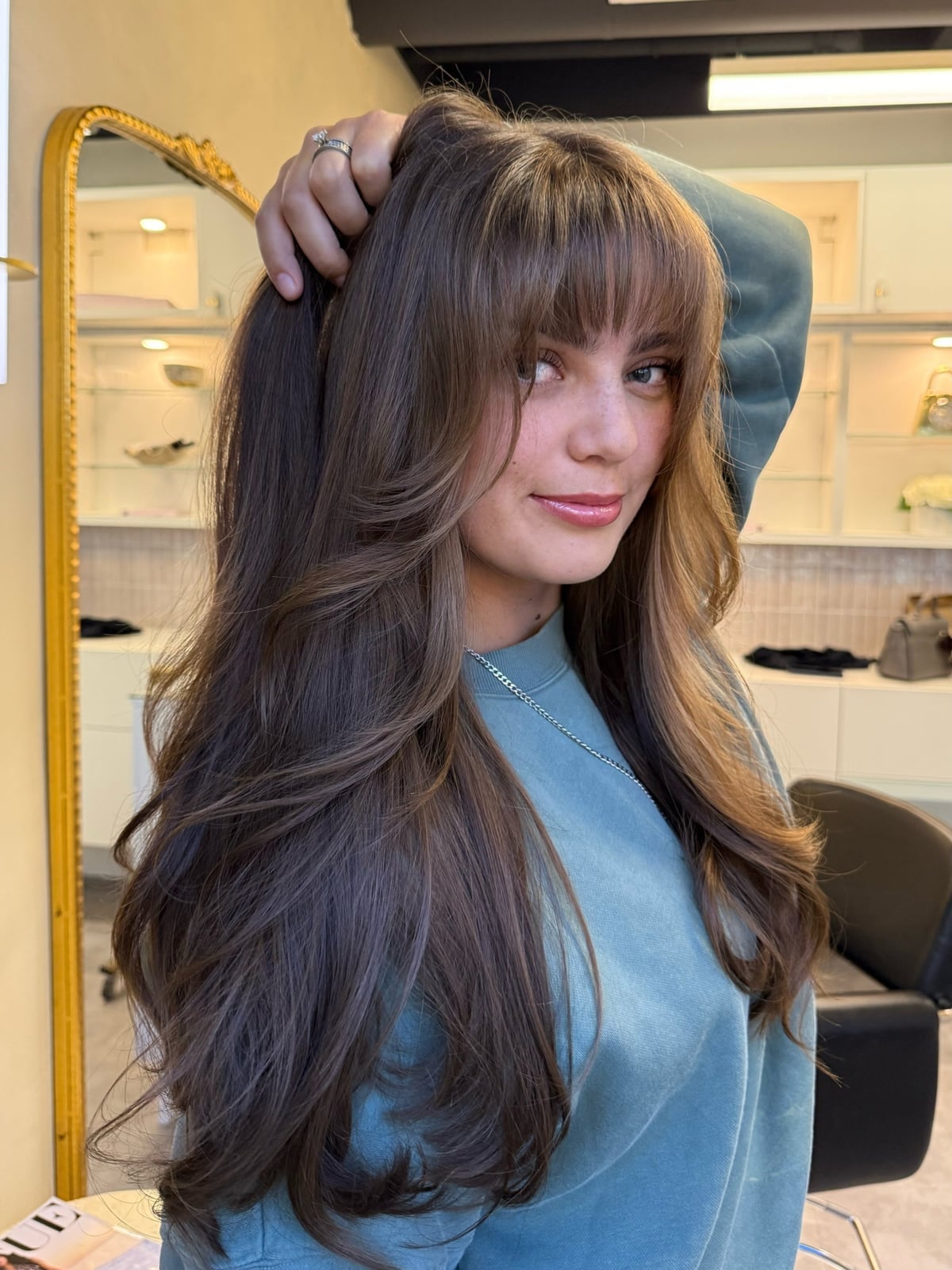 Mid-Back Ponytail With Casual Curtain Bangs Mid-Back Ponytail With Casual Curtain Bangs — Trendy Bangs Style
