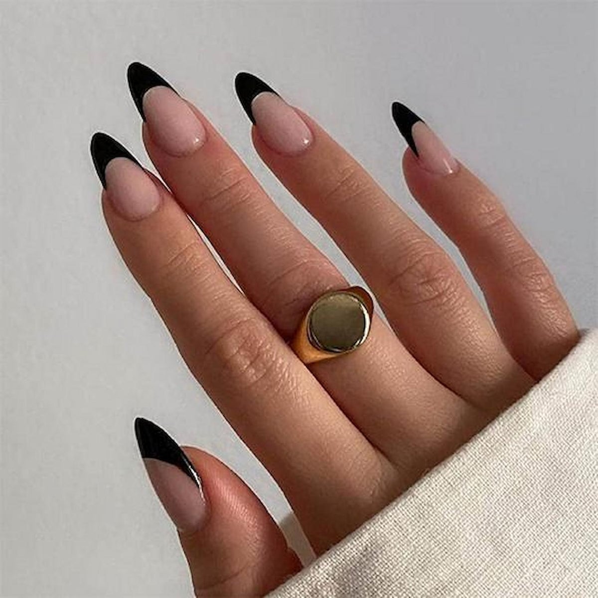 Sheer Nude Sharp Black French Tip Medium Almond Nails, Close-Up Take Sheer Nude Sharp Black French Tip Medium Almond Nails, Close-Up Take — Trendy Black Almond Nails