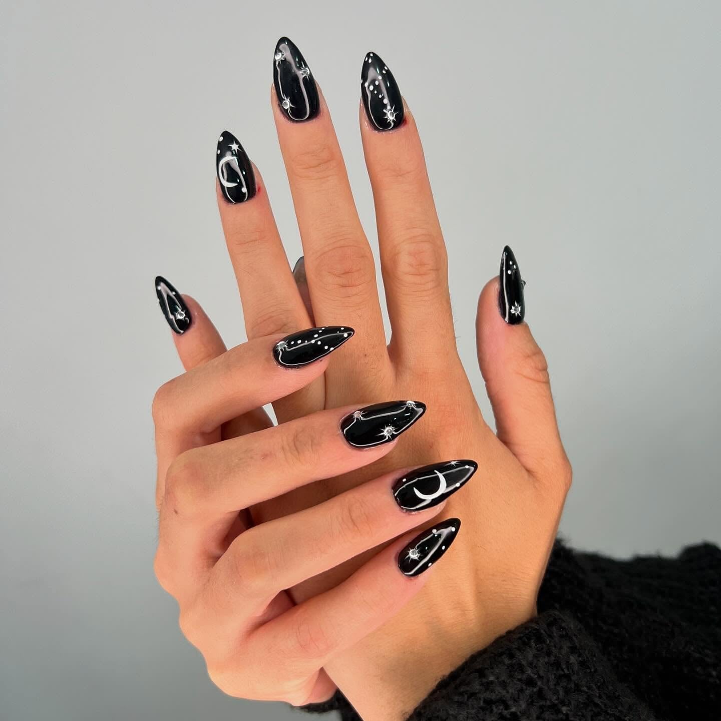 Glossy Black White Celestial Art Medium Almond Nails Glossy Black White Celestial Art Medium Almond Nails — Trendy Black Almond Nails