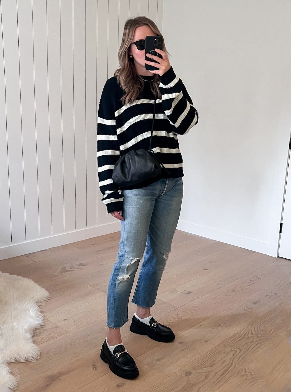 Chunky Black Loafers With Striped Sweater And Jeans — Trendy Black Loafers Outfit