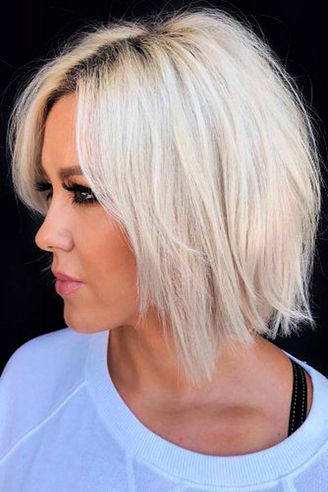 Chin Length Platinum Blonde Bob With Side-Swept Bangs, Close-Up Take — Trendy Blonde Bob