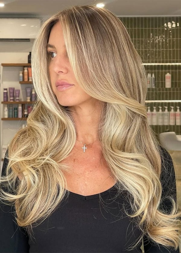 40 Blonde Hair Shades to Lighten Up Your Look : Sunlit Bronde with Voluminous Waves