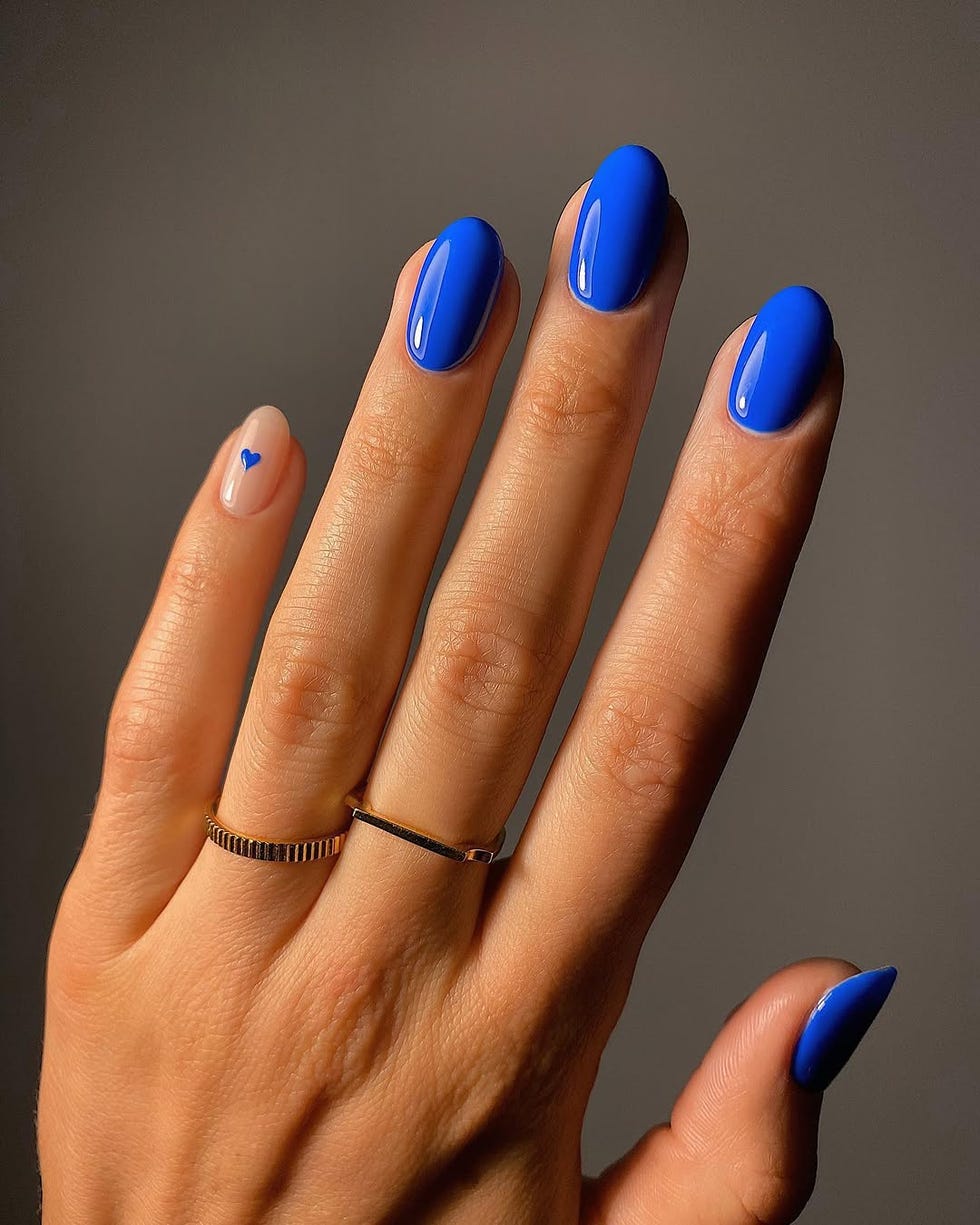Short Almond Sheer Nude Tiny Blue Heart Short Almond Sheer Nude Tiny Blue Heart — Trendy Blue Acrylic Nails