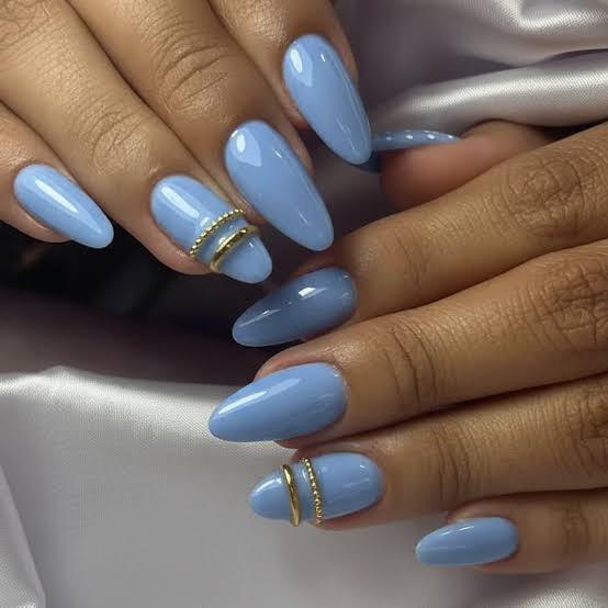 Medium Almond Light Blue Gold Ring Accent Medium Almond Light Blue Gold Ring Accent — Trendy Blue Acrylic Nails