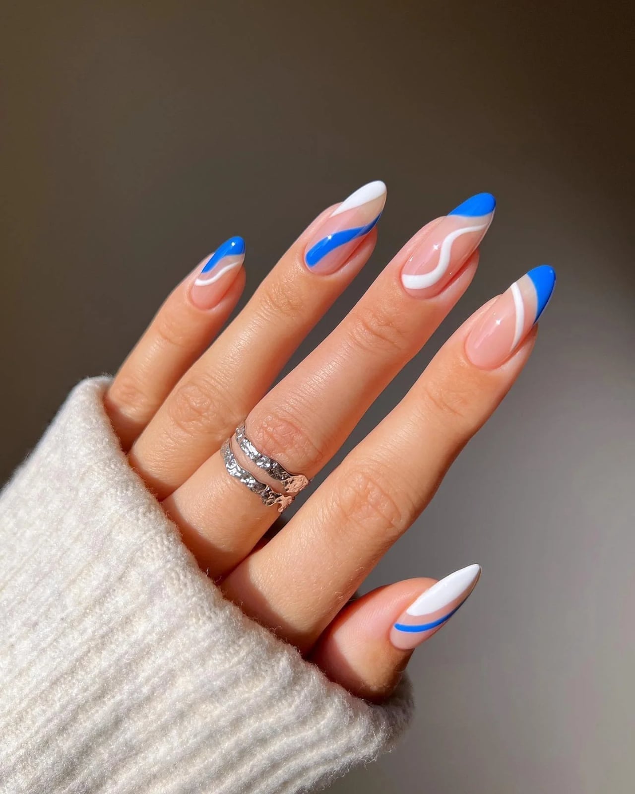 Sheer Nude Blue White Wavy Lines Almond Nails Sheer Nude Blue White Wavy Lines Almond Nails — Trendy Blue Almond Nails