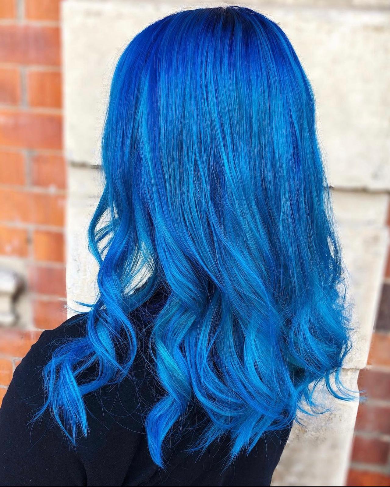 Shoulder Length Vibrant Electric Blue With Showcasing A Thick — Trendy Blue Hair Color