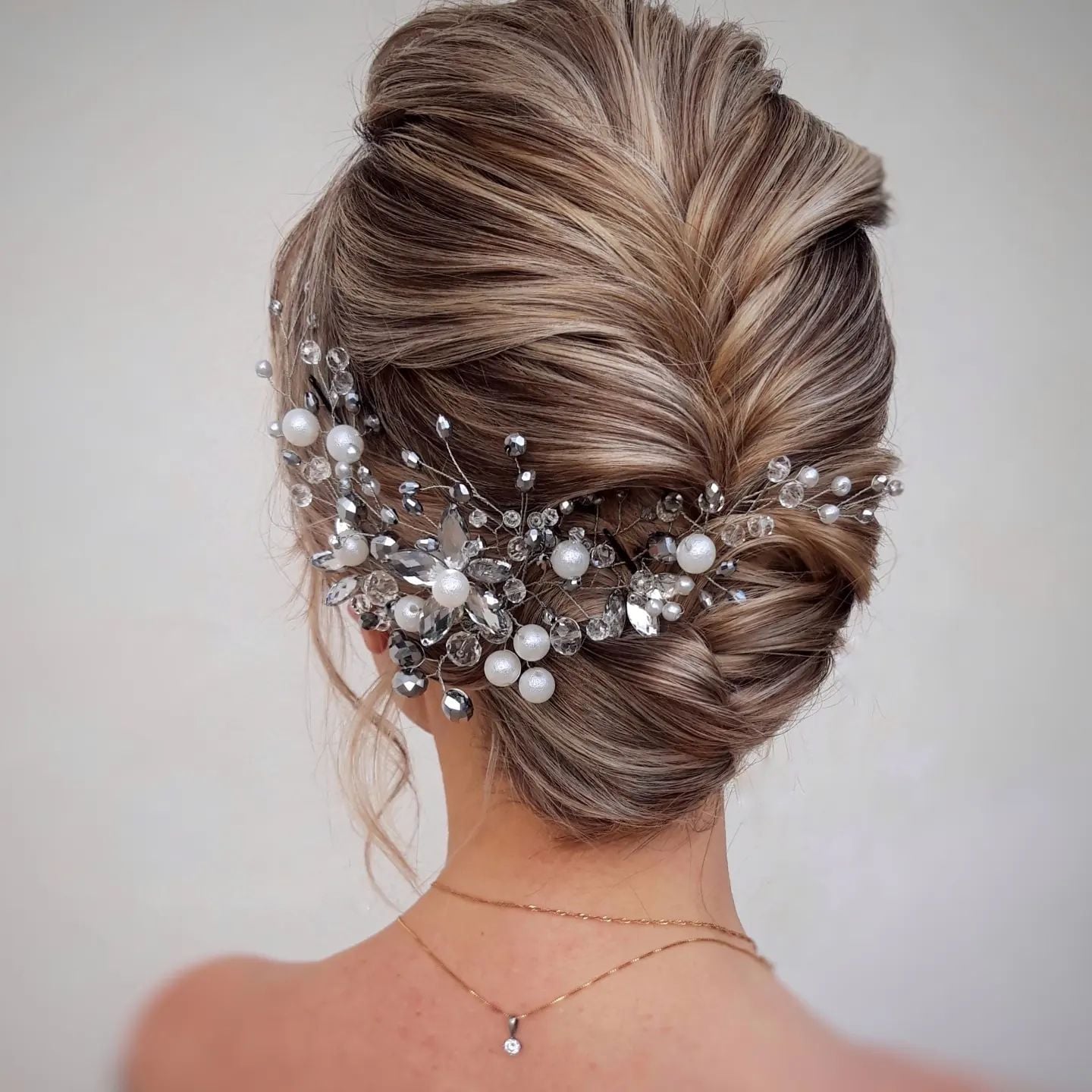 Ash Blonde High Bun With Twisted Details And Jewels — Trendy Bridal Hair