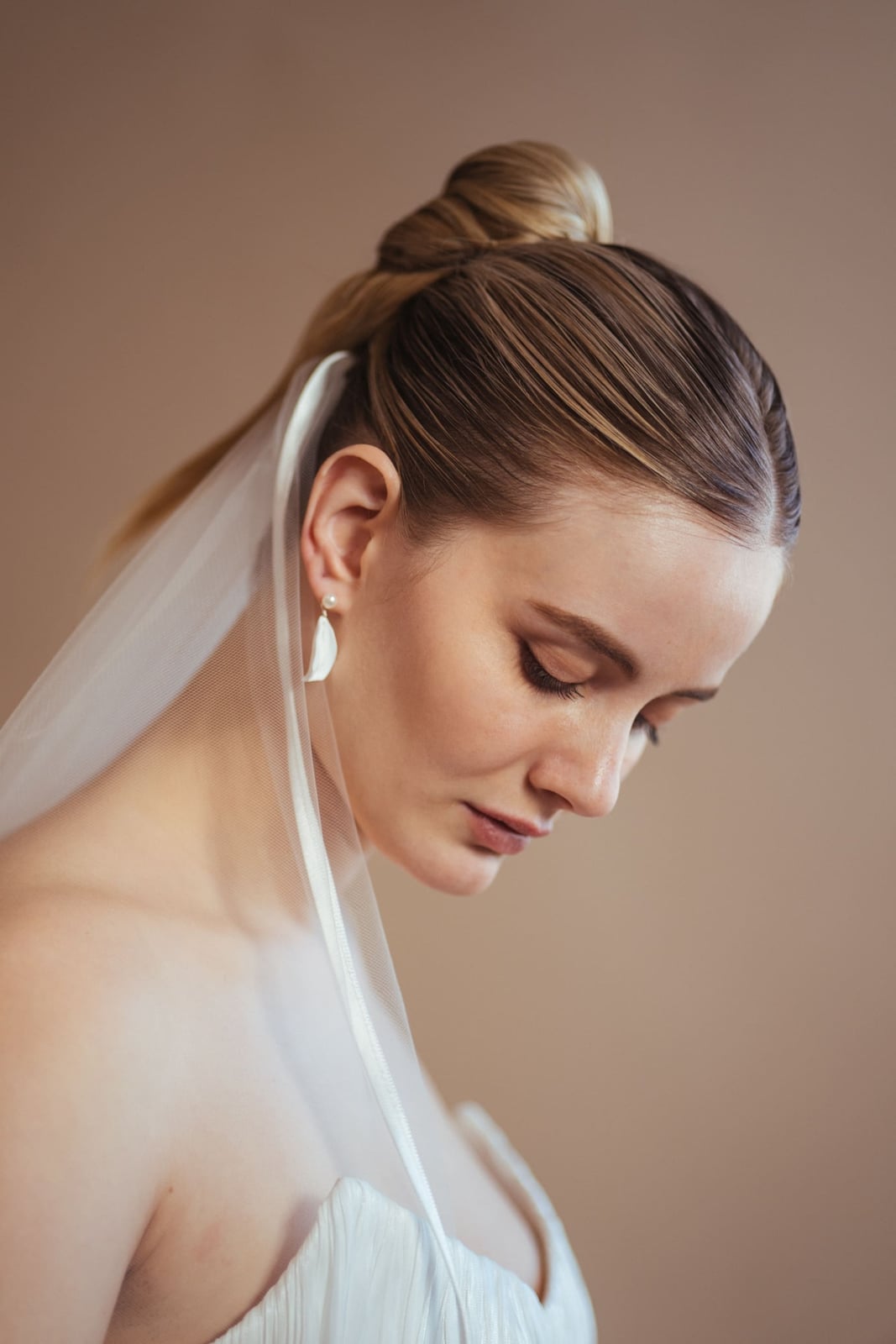Dark Brown Sleek High Ponytail With Veil — Trendy Bridal Hair