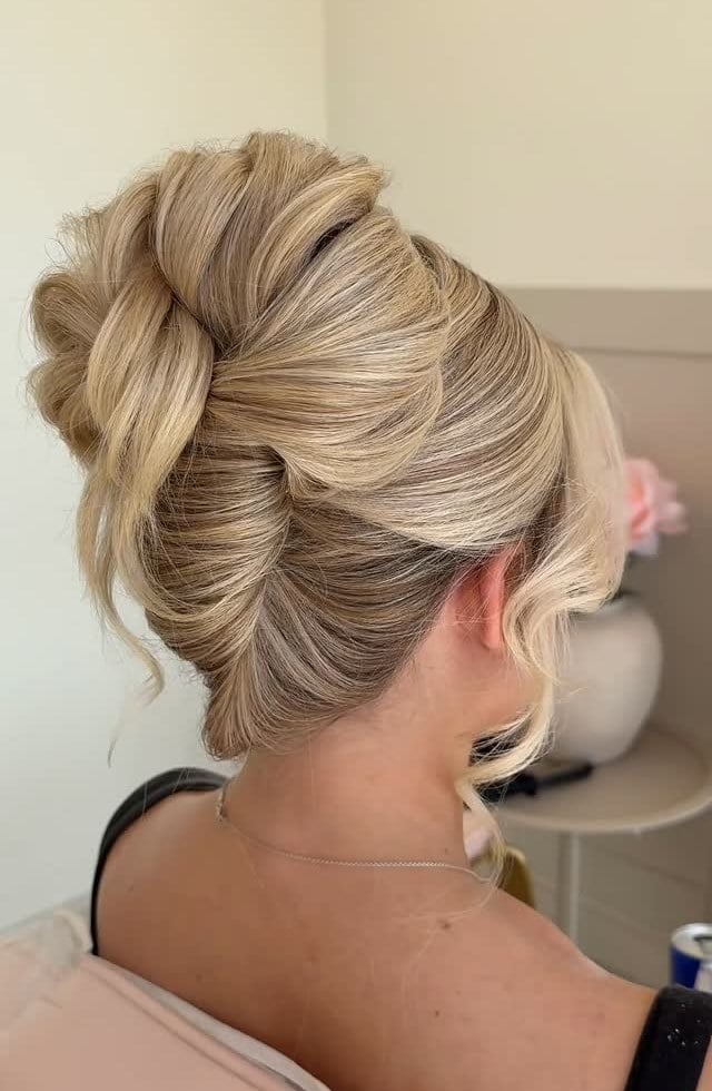 Blonde French Twist Updo With Soft Tendrils — Trendy Bridal Hair