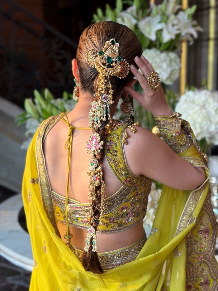 Dark Brown Mid-Back Braid With Ornate Jewelry — Trendy Bridal Hair