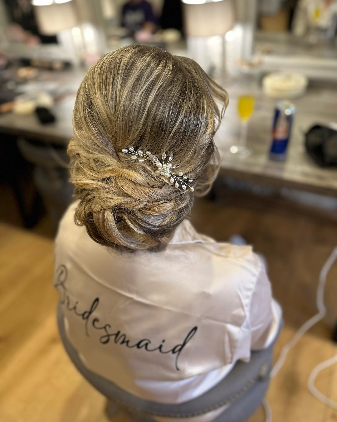 Textured Blonde Updo With Ornate Accessory — Trendy Bridesmaid Hair