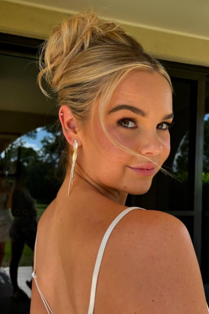 Neat Blonde High Updo With Loose Strands Neat Blonde High Updo With Loose Strands — Trendy Bridesmaid Hair Updo