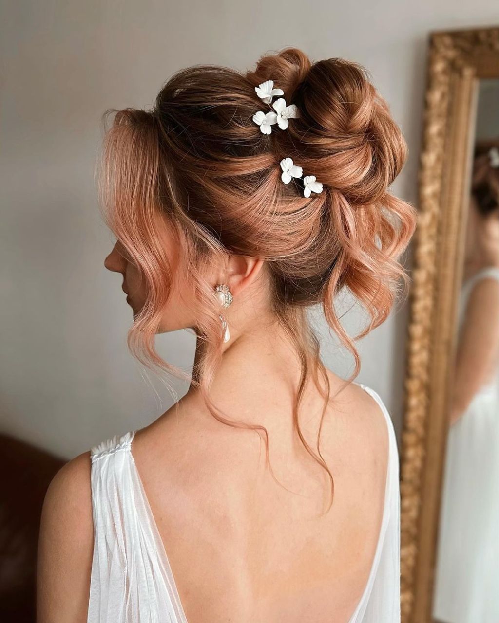 Rose Gold Messy Updo With Butterfly Pins Rose Gold Messy Updo With Butterfly Pins — Trendy Bridesmaid Hair Updo