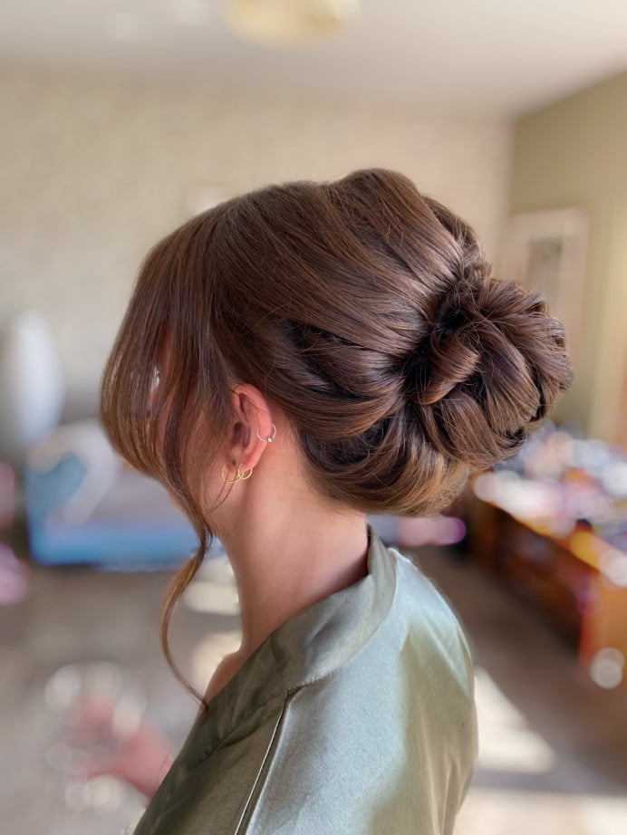 Sculpted Dark Brown Twisted Low Bun Sculpted Dark Brown Twisted Low Bun — Trendy Bridesmaid Hair Updo
