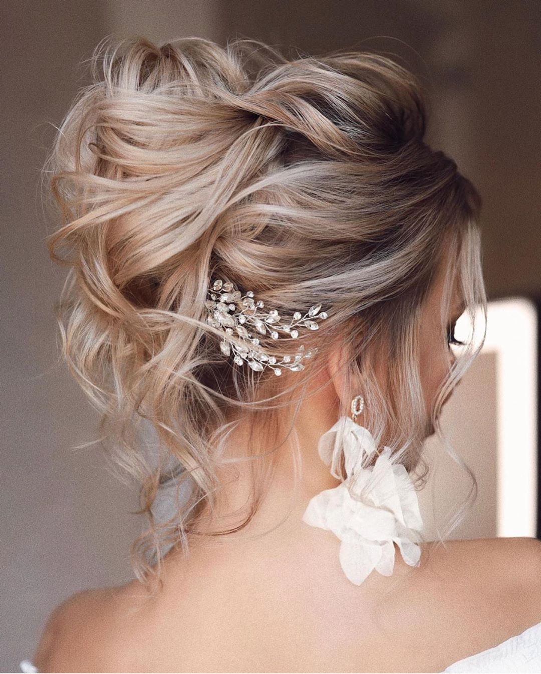 Textured Blonde Updo With Sparkling Accessory Textured Blonde Updo With Sparkling Accessory — Trendy Bridesmaid Hair Updo