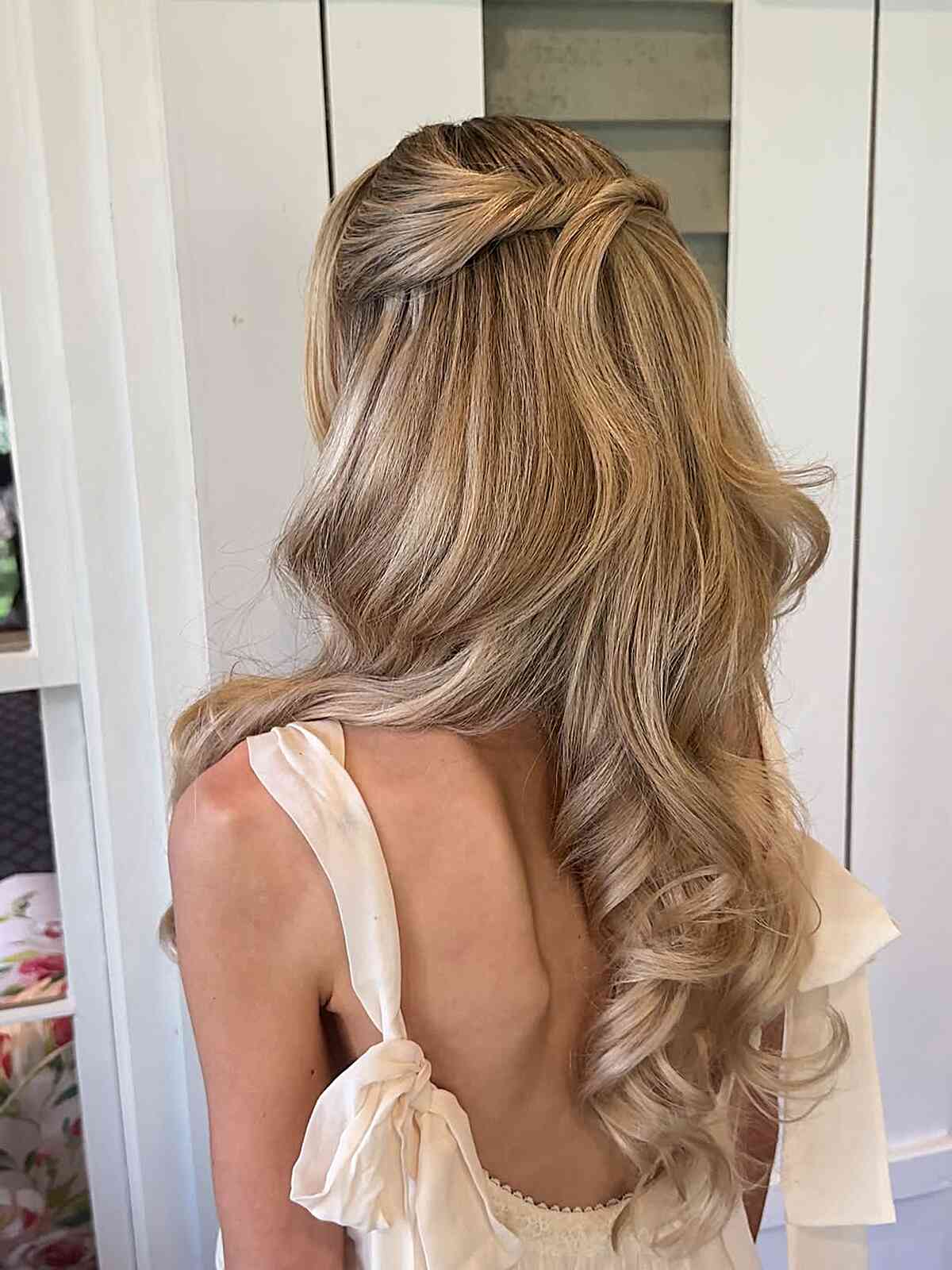 Ash Blonde Mid-Back Twisted Half Up With Curtain Bangs — Trendy Bridesmaid Hairstyles Down