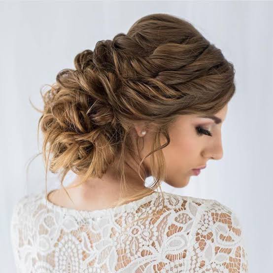 Medium Brown Twisted Updo Loose Tendrils — Trendy Bridesmaid Hairstyles Updo