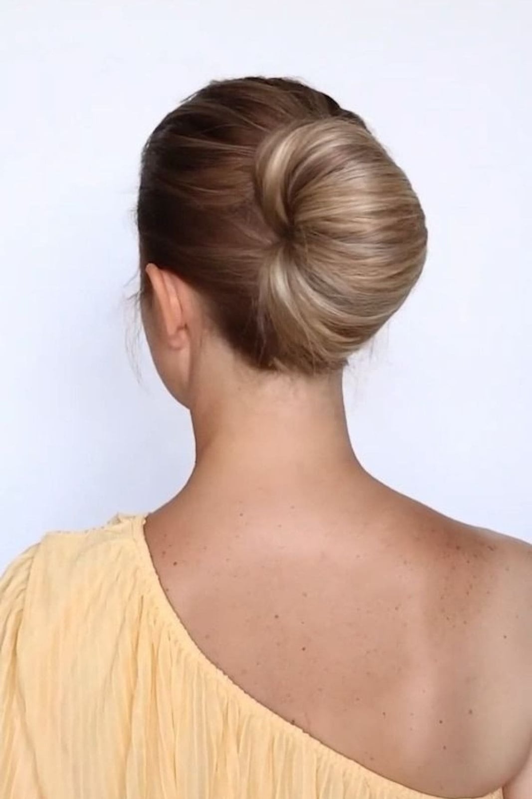 Blonde Dark Roots Sleek Low Bun — Trendy Bridesmaid Hairstyles Updo