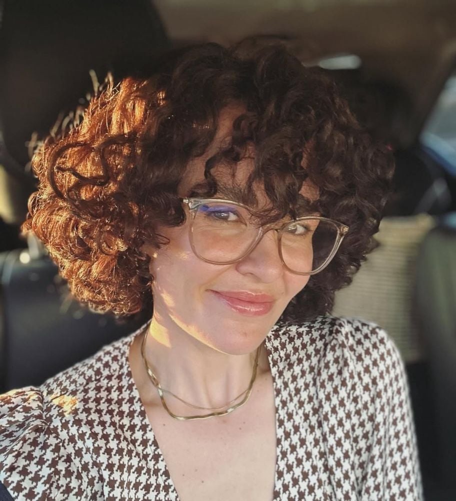 Collarbone Curls With Face-Framing Bangs Collarbone Curls With Face-Framing Bangs — Trendy Brown Curly Hair