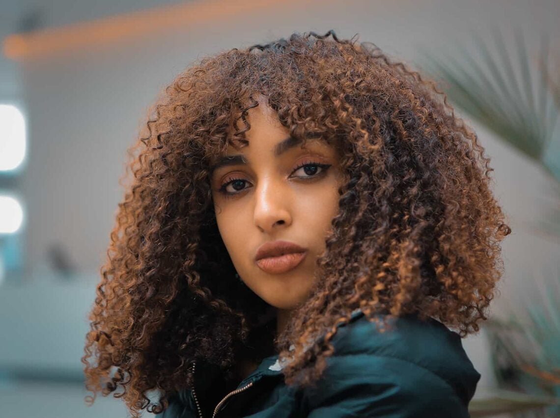 Shoulder Length Curls With Rich Colour Contrast Shoulder Length Curls With Rich Colour Contrast — Trendy Brown Curly Hair