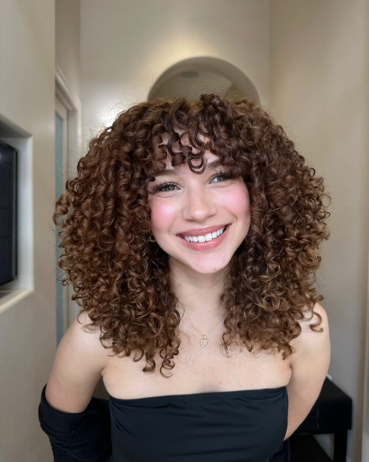 Shoulder Length Curls With Curtain Bangs Shoulder Length Curls With Curtain Bangs — Trendy Brown Curly Hair