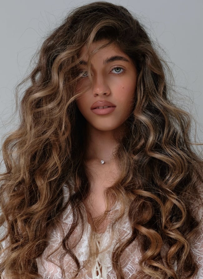 Mid-Back Waves With Dimensional Colour Mid-Back Waves With Dimensional Colour — Trendy Brown Curly Hair