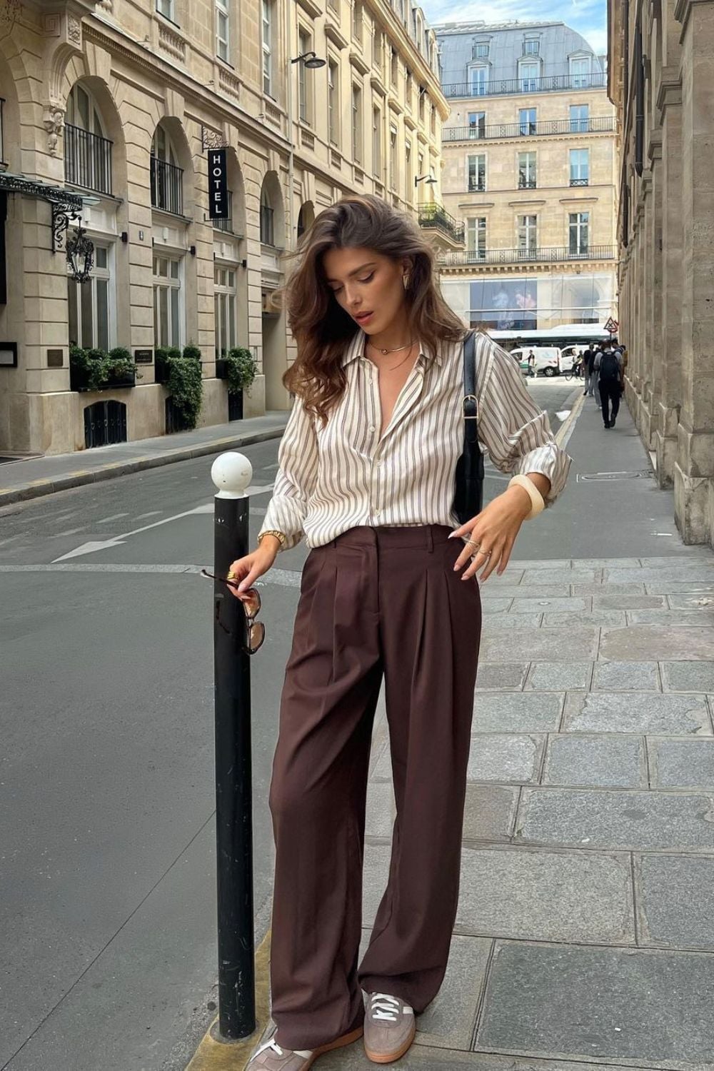 Pleated Brown Wide-Leg Trousers with a Striped Shirt Pleated Brown Wide-Leg Trousers with a Striped Shirt — Trendy Brown Trousers Outfit
