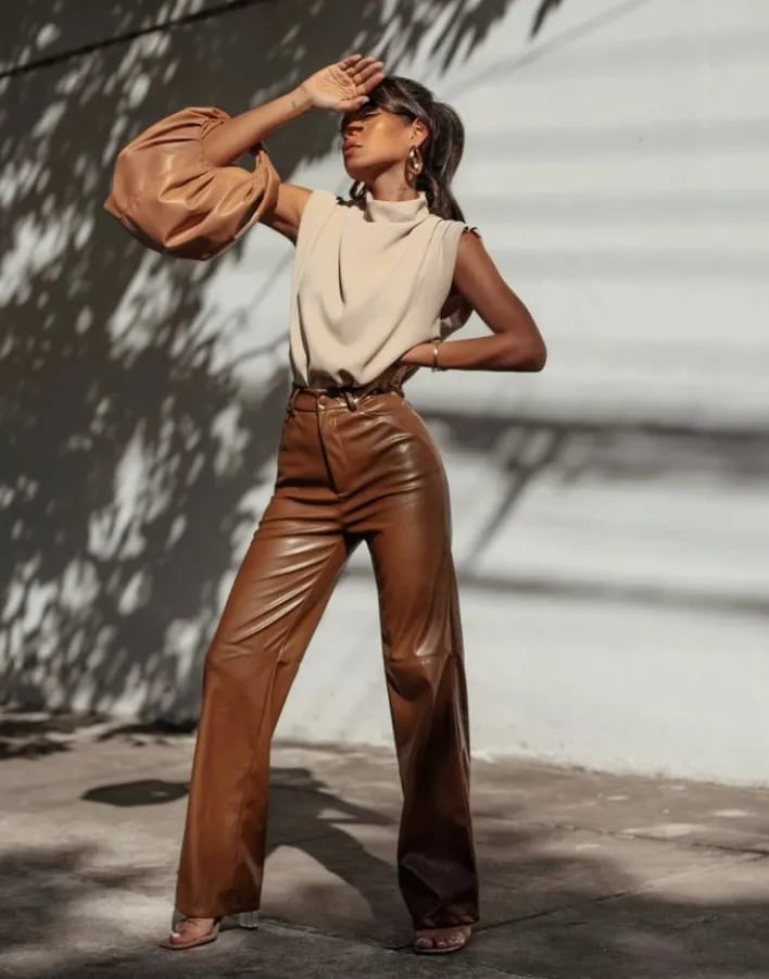 Brown Leather Wide-Leg Trousers with a Beige Top and Gold Earrings Brown Leather Wide-Leg Trousers with a Beige Top and Gold Earrings — Trendy Brown Trousers Outfit