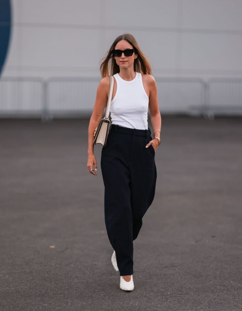 White Tank Top with Navy Wide-Leg Trousers White Tank Top with Navy Wide-Leg Trousers — Trendy Business Professional Outfits