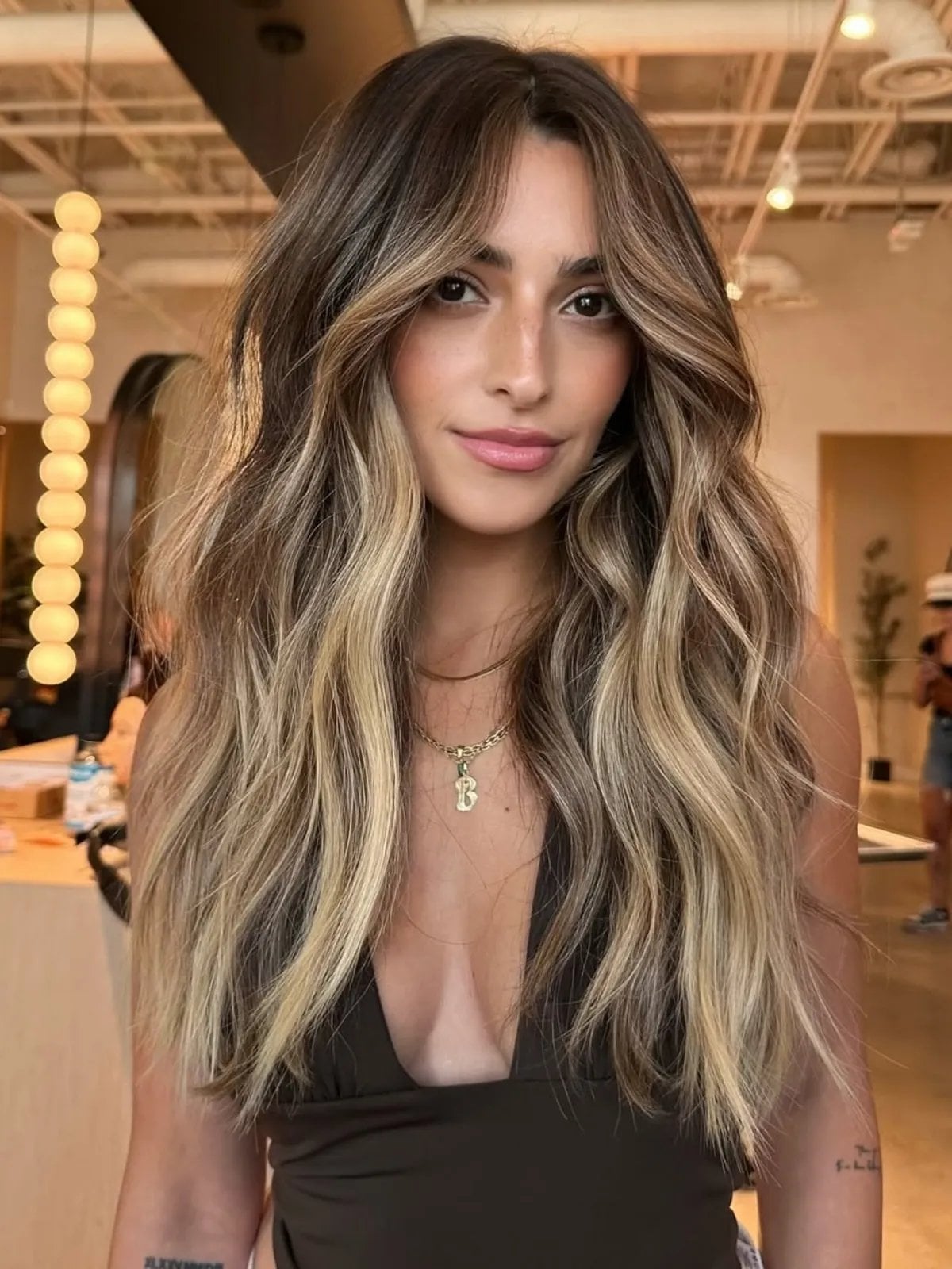 Dark Blonde With Caramel Balayage And Curtain Bangs Dark Blonde With Caramel Balayage And Curtain Bangs — Trendy Caramel Hair Color