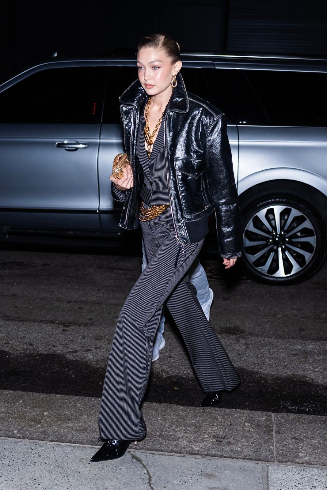 Oversized Leather Jacket Over Pinstripe Vest And Trousers Oversized Leather Jacket Over Pinstripe Vest And Trousers — Trendy Casual Birthday Outfit