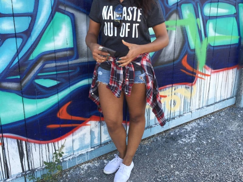 Graphic T-Shirt With Plaid Flannel And Distressed Shorts Graphic T-Shirt With Plaid Flannel And Distressed Shorts — Trendy Casual Concert Outfit