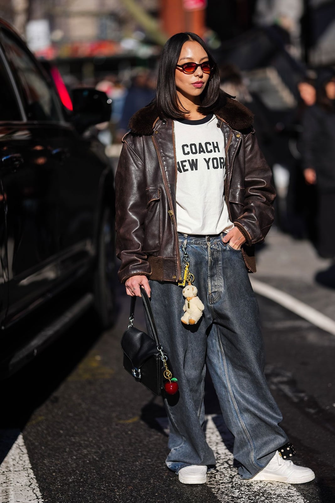 Leather Jacket Over Graphic Tee With Wide Leg Jeans Leather Jacket Over Graphic Tee With Wide Leg Jeans — Trendy Casual Concert Outfit