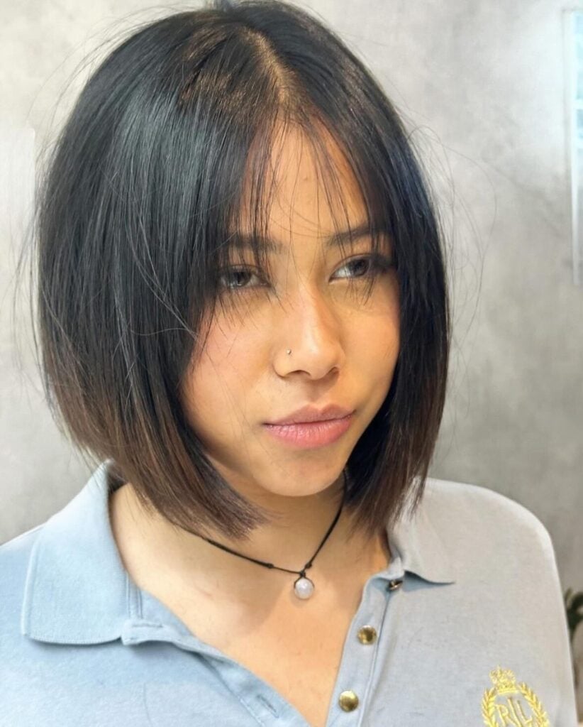 Dark Brown Bob With Textured Curtain Bangs, Close-Up Take — Trendy Chin Length Hair