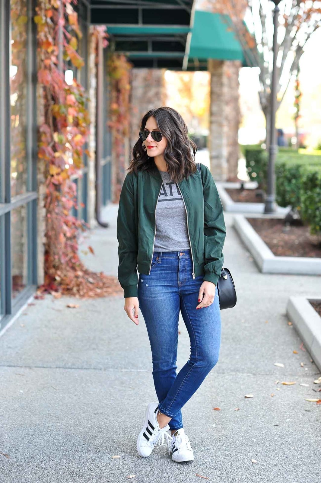 Bomber Jacket Over T-Shirt with Blue Jeans — Trendy College Outfits