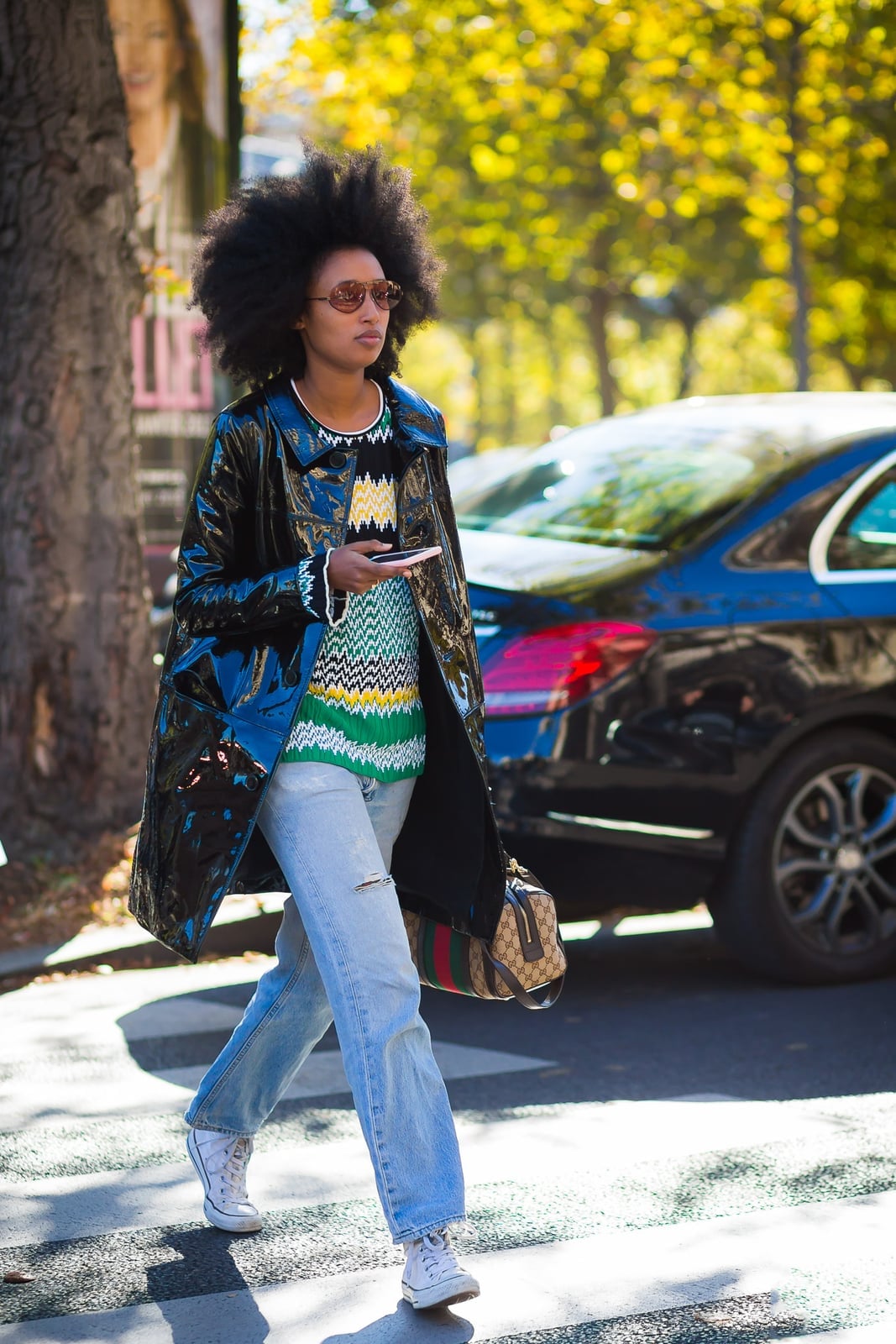 Patent Trench Coat Over Knit Sweater and Ripped Jeans with Low Top — Trendy Converse Outfits