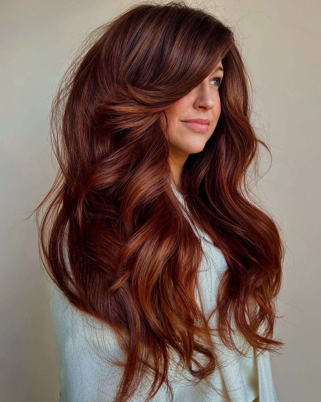 Mid-Back Deep Copper Waves With Curtain Bangs — Trendy Copper Hair