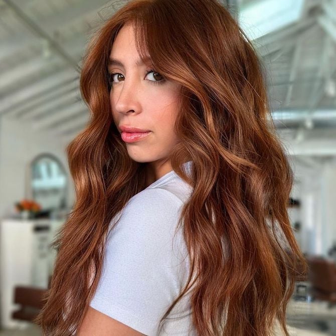Collarbone Copper Waves With Wispy Bangs — Trendy Copper Hair