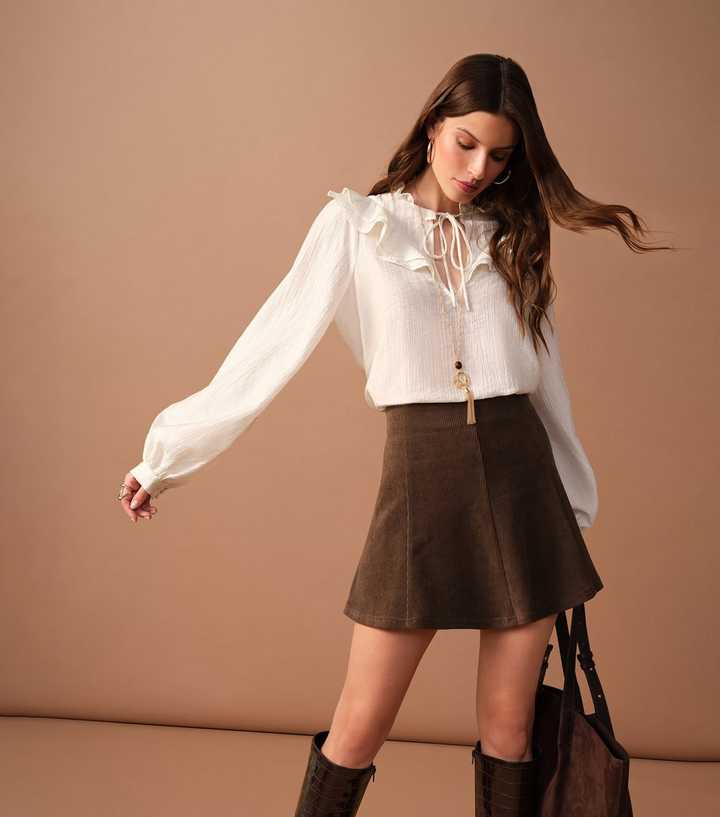 Brown Flared Corduroy Mini Skirt and Ruffled Blouse Brown Flared Corduroy Mini Skirt and Ruffled Blouse — Trendy Corduroy Skirt Outfit