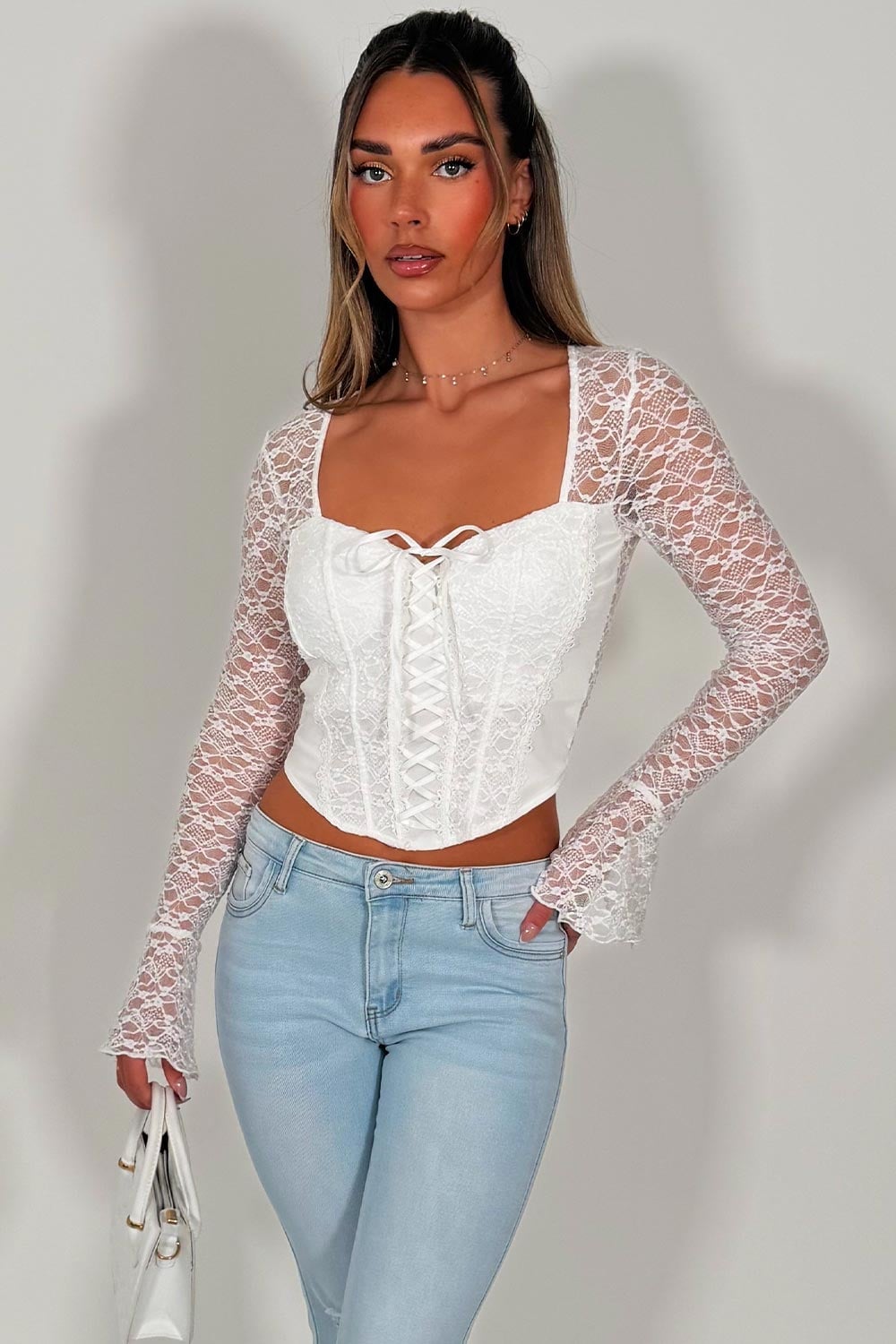White Lace Corset With Flared Sleeves and Jeans White Lace Corset With Flared Sleeves and Jeans — Trendy Corset Top Outfits