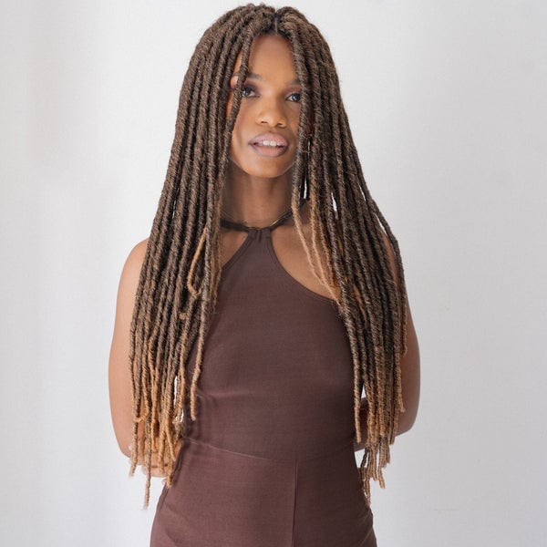 Mid-Back Crochet Locs With Blonde Highlights Mid-Back Crochet Locs With Blonde Highlights — Trendy Crochet Hair