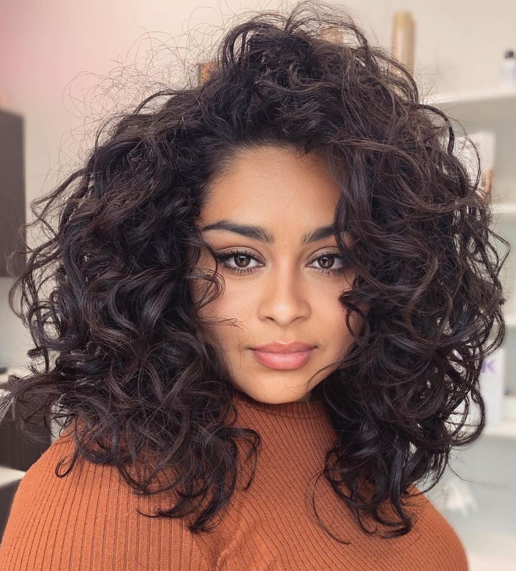 Collarbone Layers With Subtle Highlights — Trendy Curly Hair Natural