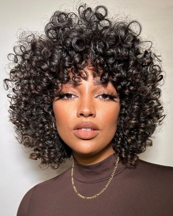 Collarbone Shag With Full Curtain Bangs — Trendy Curly Hair Natural
