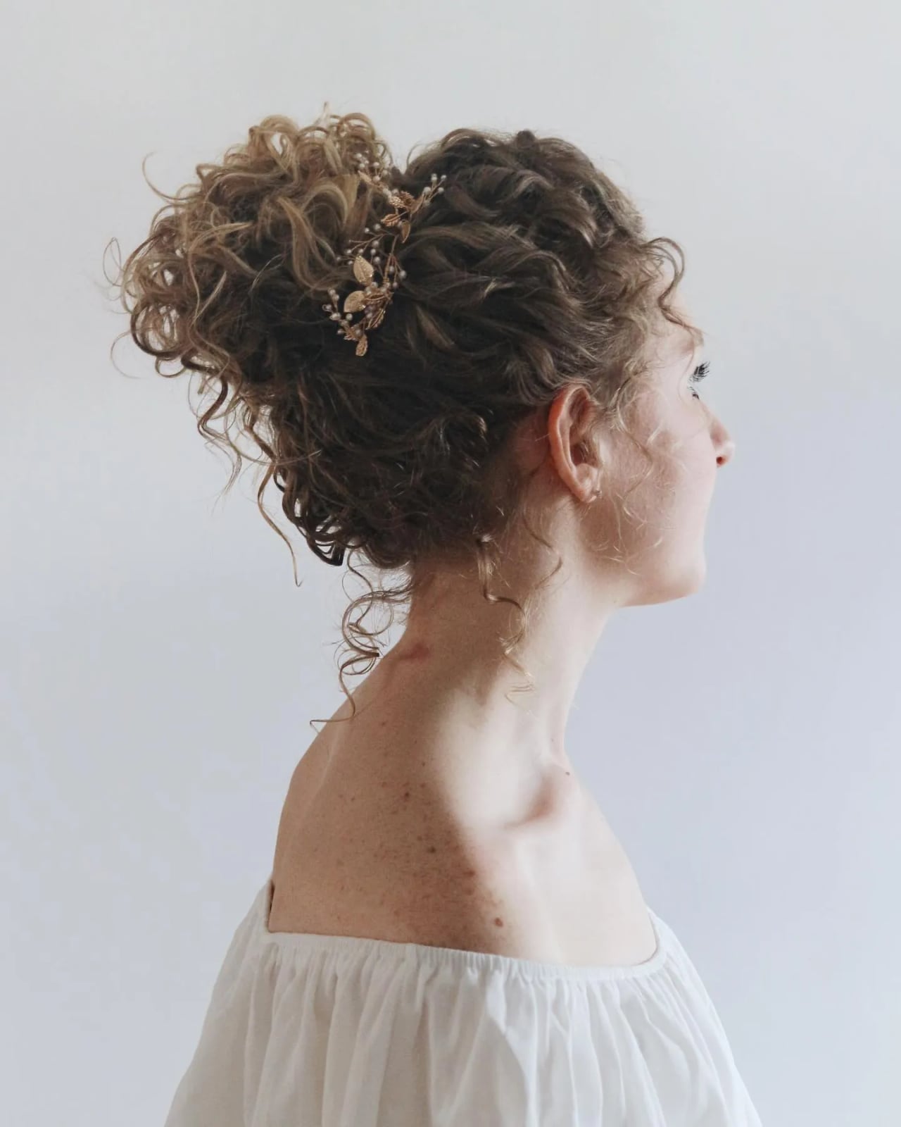 Dark Brown Updo With Blonde Highlights and Accessory and Curtain Bangs Dark Brown Updo With Blonde Highlights and Accessory and Curtain Bangs — Trendy Curly Updo