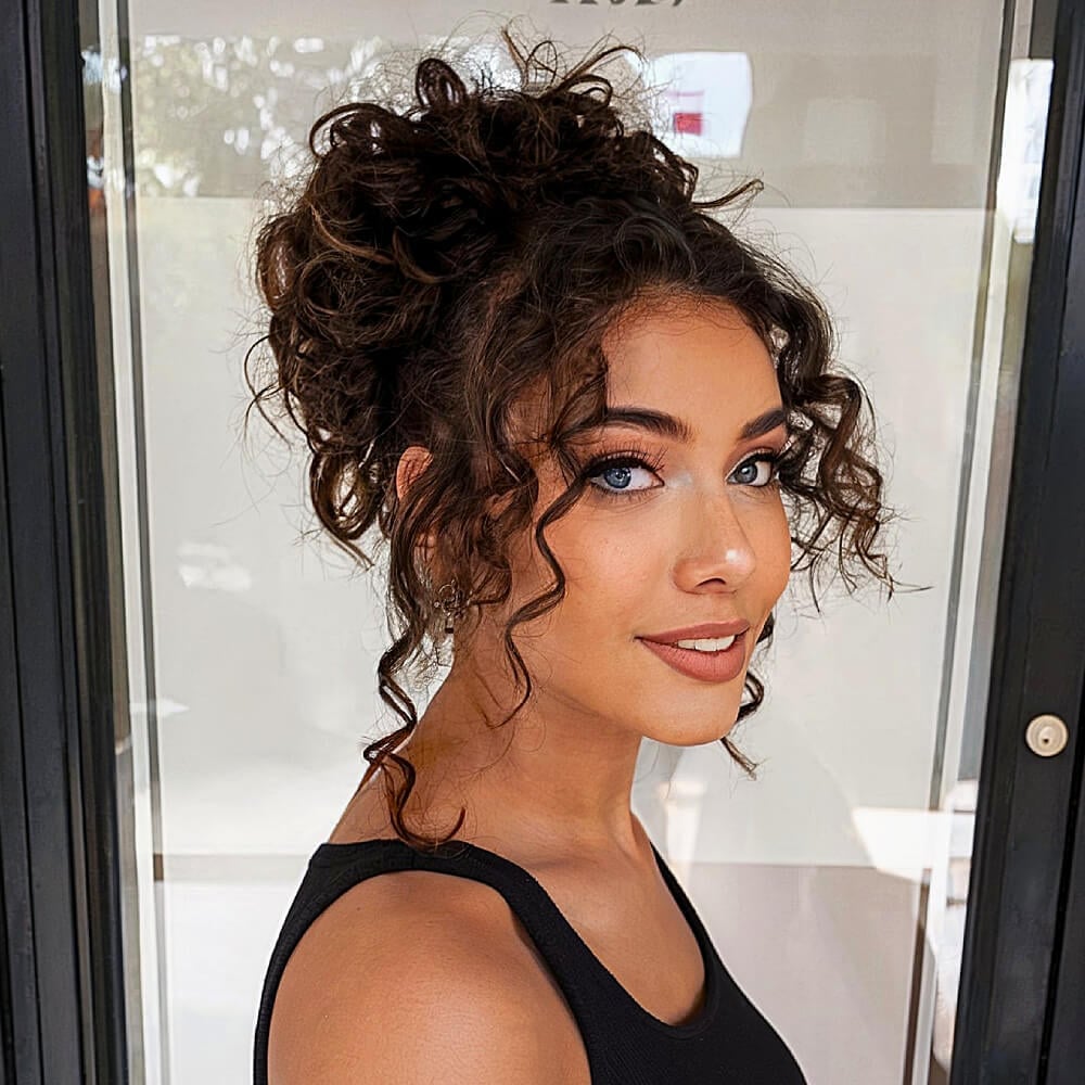 Messy Dark Brown Updo With Loose Tendrils Messy Dark Brown Updo With Loose Tendrils — Trendy Curly Updo