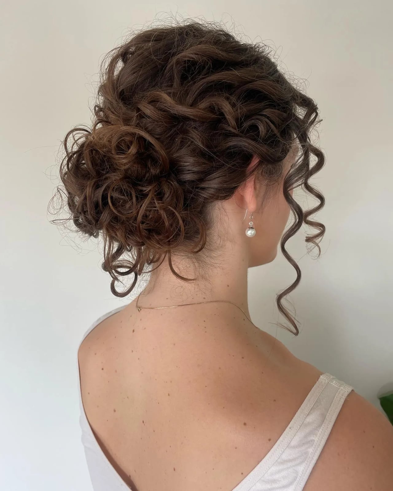 Sophisticated Dark Brown Updo With Defined Curls Sophisticated Dark Brown Updo With Defined Curls — Trendy Curly Updo
