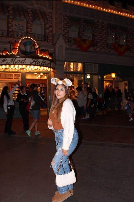 White Knit Cardigan with Ripped Blue Jeans — Trendy Disney Outfits