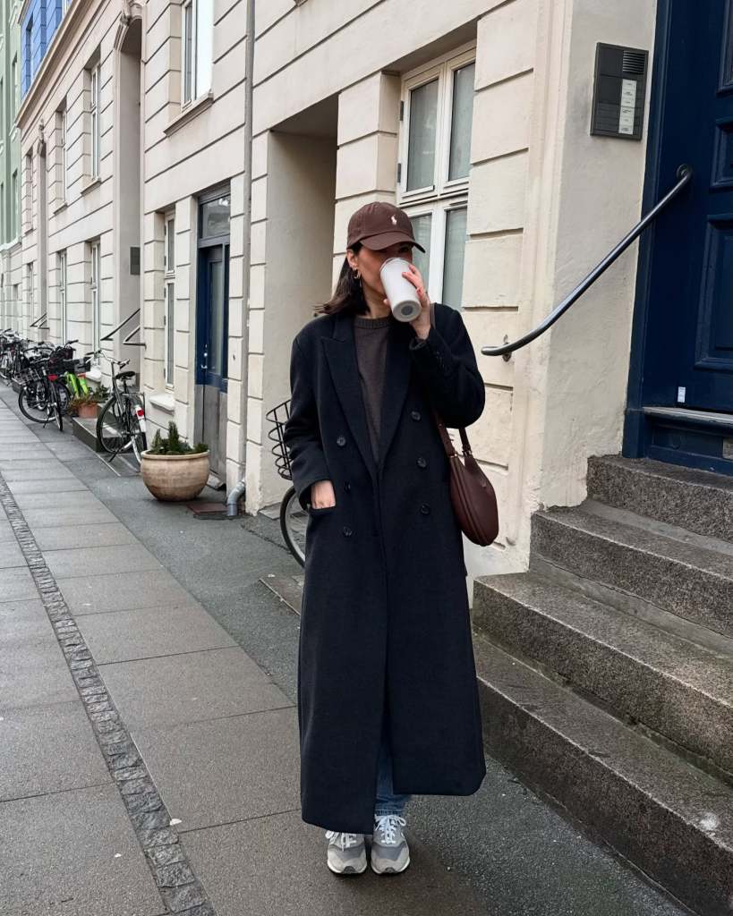 Long Wool Coat Over Sweater and Jeans, Close-Up Take Long Wool Coat Over Sweater and Jeans, Close-Up Take — Trendy Downtown Girl Outfits